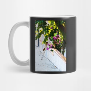 Dog staring at flowers Mug